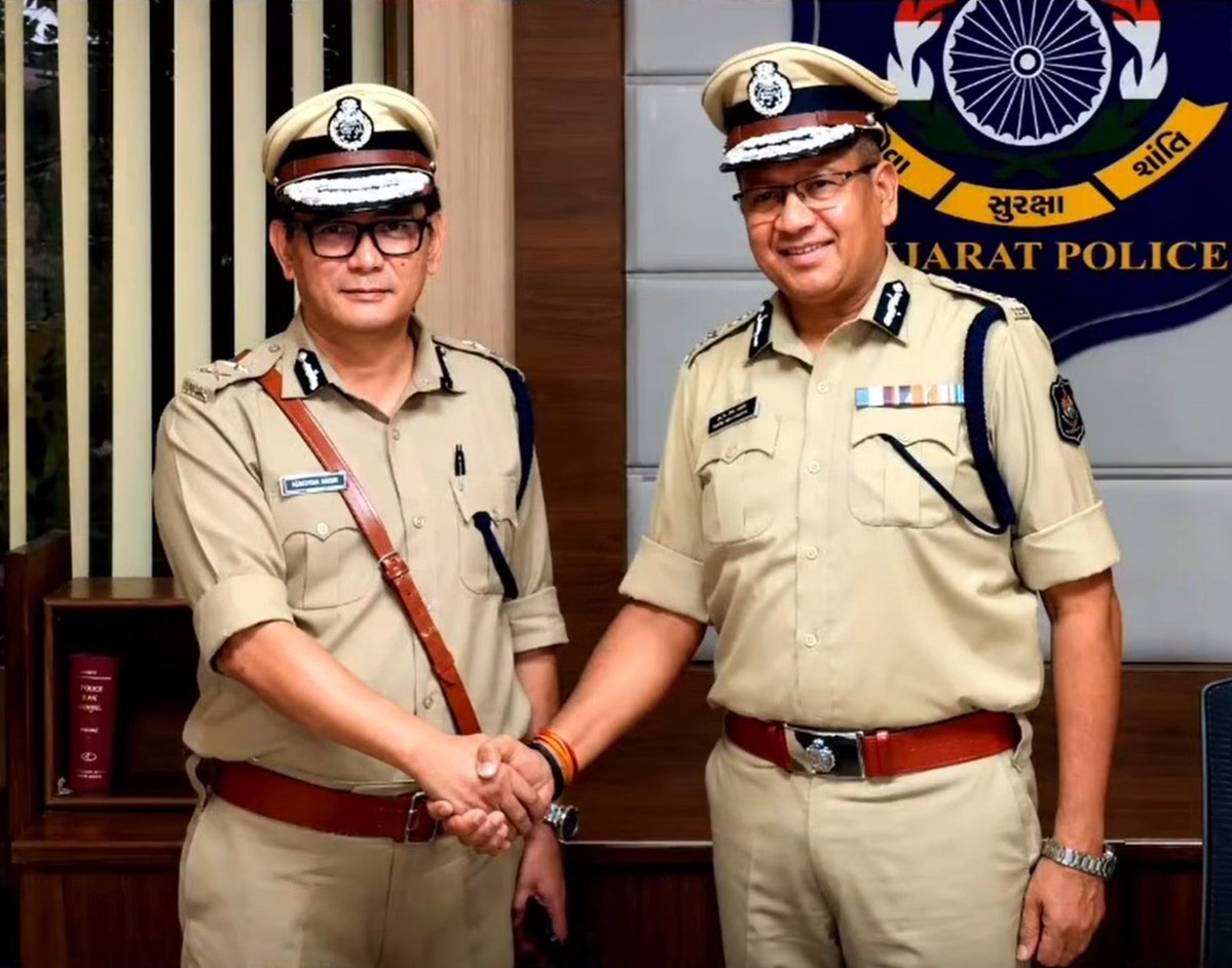 Wabang Jamir, IPS, in ceremonial uniform at a Gujarat Police handover, photographed before the Gujarat Police emblem.