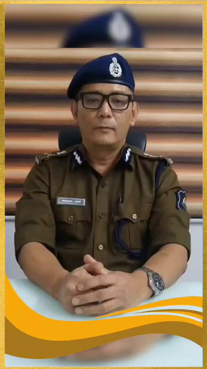 Wabang Jamir, IPS, in police uniform delivering an official address from his desk.